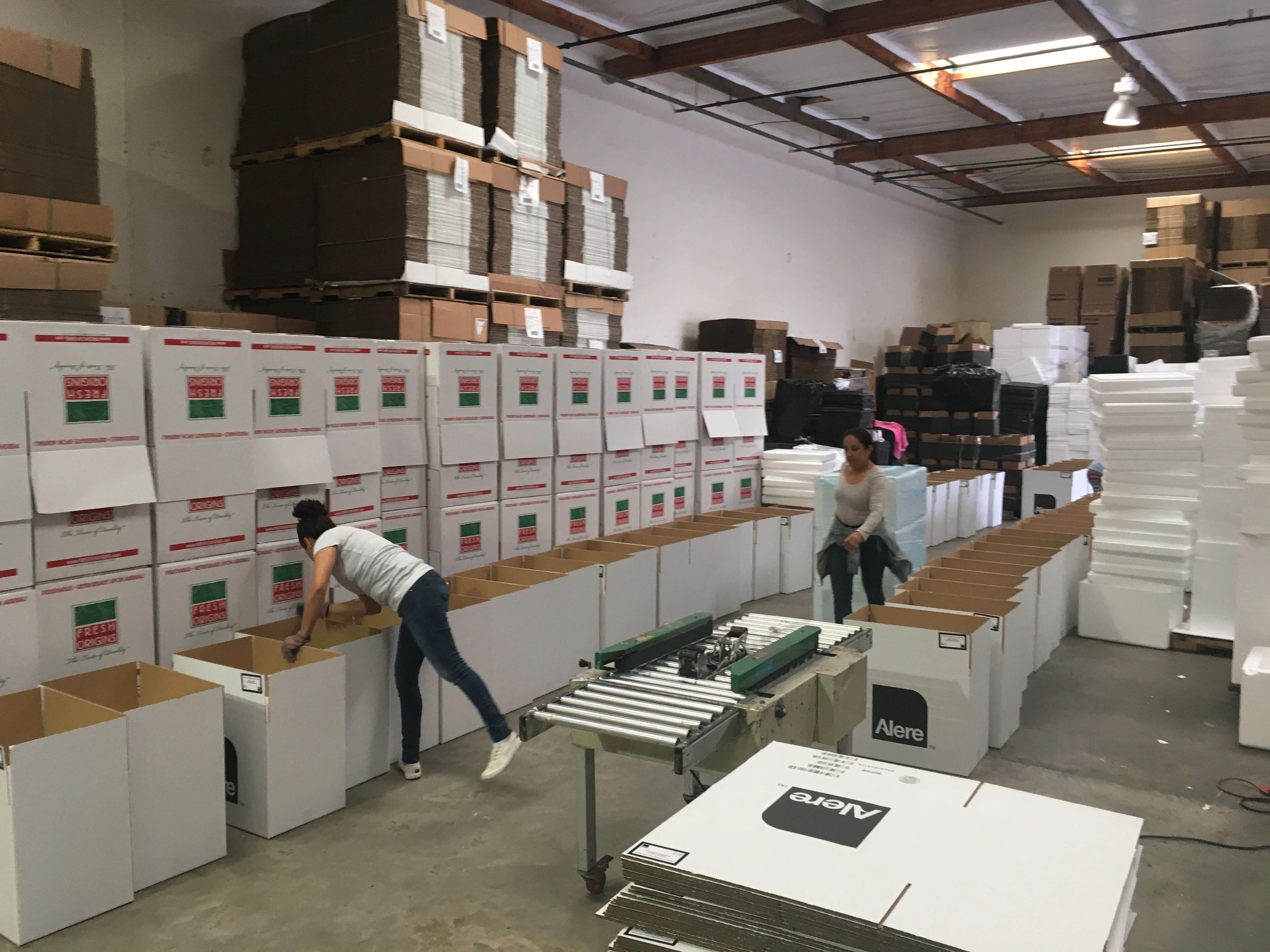 Workers fulfilling packaging orders